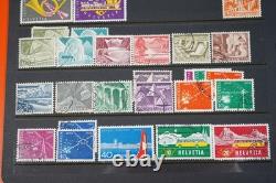 Collection de 2 300+ timbres de Suisse neufs et utilisés sur pages de stock dans un album