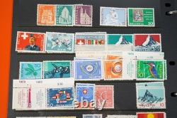 Collection de 2 300+ timbres de Suisse neufs et utilisés sur pages de stock dans un album