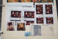 Collection de 2 600+ timbres de Russie neufs et utilisés stockés dans un album Monarch