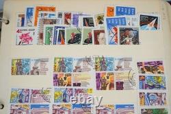 Collection de 2 600+ timbres de Russie neufs et utilisés stockés dans un album Monarch