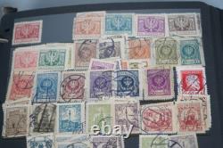 Collection de Pologne de plus de 4500 timbres neufs et utilisés stockés dans un album sur des pages de stock