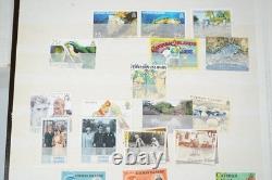 Collection de colonies britanniques de plus de 550 timbres neufs et oblitérés dans un stockbook Uni-Safe