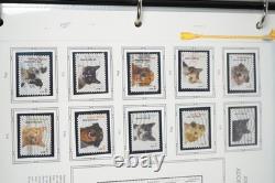 Collection de quelques centaines de timbres US 2010 neufs et utilisés stockés dans un album White Ace