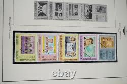 Collection de timbres de Ras Al Khaimah et Saint-Vincent JFK de plus de 110 timbres et 70 feuilles dans un album