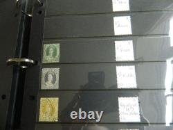 Collection de timbres du Queensland et timbres usagés sur pages Hagner dans un grand album