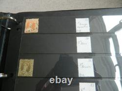 Collection de timbres du Queensland et timbres usagés sur pages Hagner dans un grand album