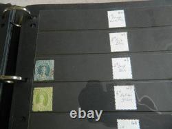 Collection de timbres du Queensland et timbres usagés sur pages Hagner dans un grand album