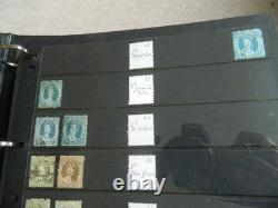 Collection de timbres du Queensland et timbres usagés sur pages Hagner dans un grand album