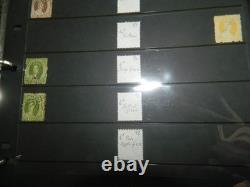 Collection de timbres du Queensland et timbres usagés sur pages Hagner dans un grand album