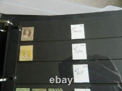 Collection de timbres du Queensland et timbres usagés sur pages Hagner dans un grand album