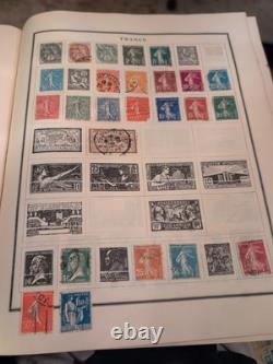 Collection de timbres du monde entier dans un album classique moderne des années 50 rempli de philatélie +