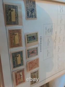 Collection de timbres du monde entier dans un album international Scott de 1933 en parfait état.