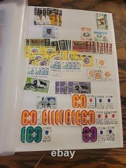 Collection de timbres du monde entier dans un album plein de timbres neufs et utilisés Royal Mail HK