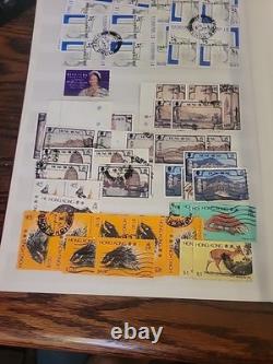 Collection de timbres du monde entier dans un album plein de timbres neufs et utilisés Royal Mail HK