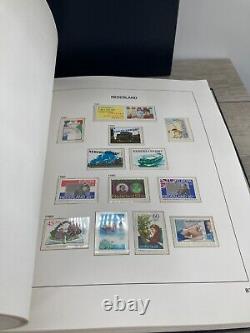 Collection de timbres étrangers non utilisés du livre d'albums Vintage Davo Pays-Bas III