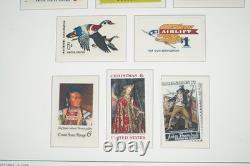 Collection de timbres neufs de plus de 825 pièces des États-Unis de 1965 à 1984, conservée dans un album Light House.