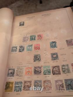 Collection de timbres vintage Plus du monde entier des années 1800 dans un album Schwanberg Briefmarken