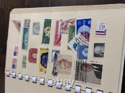 Collection de timbres vintage et modernes avec un timbre d'un cent et une boîte en bois vintage