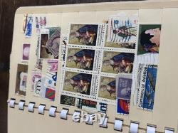 Collection de timbres vintage et modernes avec un timbre d'un cent et une boîte en bois vintage