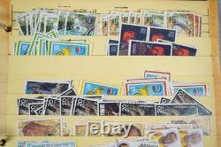 Collection du Commonwealth britannique de plus de 1 700 timbres oblitérés conservés dans un album