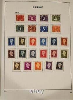 Collection du Suriname dans l'album sans charnière Davo Vol. 1 avec des timbres principalement neufs non charniérés