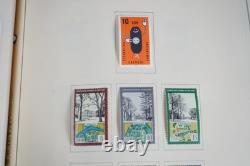 Collection mondiale G 1981-2000 de plus de 2 750 timbres neufs et oblitérés dans un album Scott