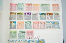 Collection mondiale de 1 375 timbres, principalement oblitérés, conservés dans un stockbook Cruiser