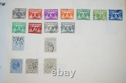 Collection mondiale de plus de 1 100 timbres neufs et oblitérés, conservés dans un album