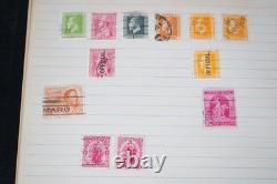 Collection mondiale de plus de 1 100 timbres neufs et oblitérés, conservés dans un album