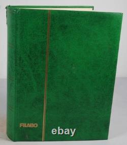 Collection mondiale de plus de 1 200 timbres neufs et usagés stockés dans un livre de collection Filabo