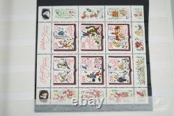 Collection mondiale de plus de 1 200 timbres neufs et usagés stockés dans un livre de collection Filabo