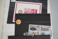 Collection mondiale de plus de 1 200 timbres neufs et usagés stockés dans un livre de collection Filabo