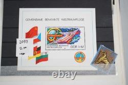 Collection mondiale de plus de 1 200 timbres neufs et usagés stockés dans un livre de collection Filabo