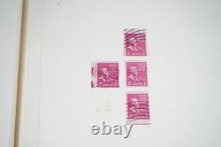 Collection mondiale de plus de 1 400 timbres neufs et oblitérés conservés dans un album