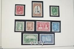 Collection mondiale de plus de 1 400 timbres neufs et oblitérés, des années 1860 aux années 1980 environ, dans un album Scott