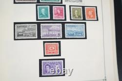 Collection mondiale de plus de 1 400 timbres neufs et oblitérés, des années 1860 aux années 1980 environ, dans un album Scott