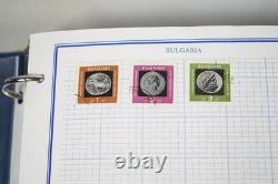 Collection mondiale de plus de 3 000 timbres neufs et utilisés stockés dans un album Mystic