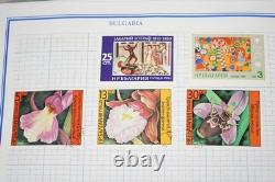 Collection mondiale de plus de 3 000 timbres neufs et utilisés stockés dans un album Mystic