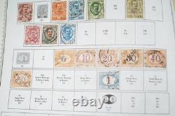 Collection mondiale de plus de 8 000 timbres des années 1870 à 1970, neufs et oblitérés, dans un album Minkus