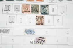 Collection mondiale de plus de 8 000 timbres des années 1870 à 1970, neufs et oblitérés, dans un album Minkus