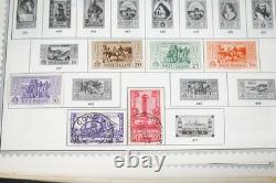Collection mondiale de plus de 8 000 timbres des années 1870 à 1970, neufs et oblitérés, dans un album Minkus
