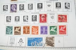 Collection mondiale de plus de 8 000 timbres des années 1870 à 1970, neufs et oblitérés, dans un album Minkus