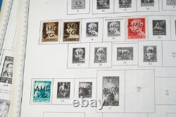 Collection mondiale de plus de 8 000 timbres des années 1870 à 1970, neufs et oblitérés, dans un album Minkus