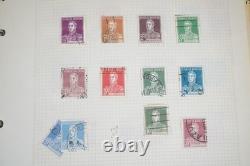 Collection mondiale de près de 2 000 timbres neufs et oblitérés dans un album