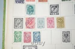 Collection mondiale de près de 2 000 timbres, principalement oblitérés, conservés dans un album