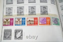Collection mondiale des années 1880 aux années 1960 de plus de 3 200 timbres neufs et oblitérés dans un album Harris