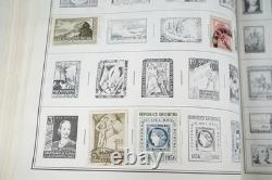 Collection mondiale des années 1880 aux années 1960 de plus de 3 200 timbres neufs et oblitérés dans un album Harris