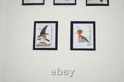 Collection thématique mondiale d'oiseaux de plus de 250 timbres MNH dans un album 1 FDC