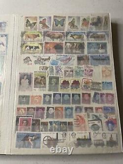 Énorme collection de timbres dans un classeur Lot États-Unis International Vintage + Plus.