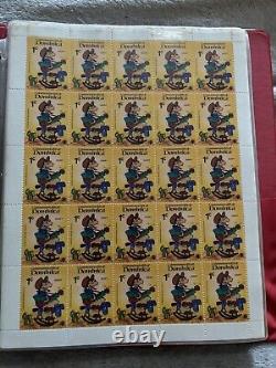 Grande collection de timbres vintage de Walt Disney dans un album de 35 feuilles complètes de 875 timbres